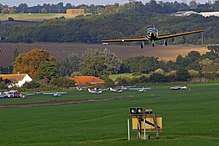 Image of an aircraft flying above the aerodrome
