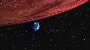 Red gas giant planet and distant small green moon