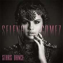 The cover image features face of Selena Gomez, laden with ornaments, upon black background. Album title appears at the bottom left.