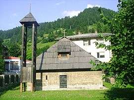 Small stone church on a hillside