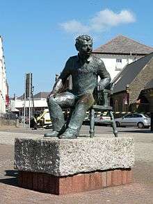 A bronze statue of Thomas in the Maritime Quarter, Swansea