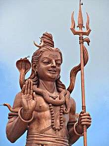 A bronze statue of Hindu god Shiva, a masculine shape with cobra on neck