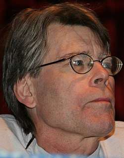 Close-up of a man wearing glasses.