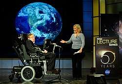 Photograph of Hawking and his daughter Lucy on-stage at a presentation
