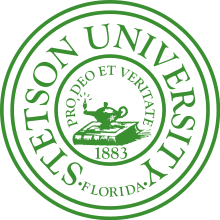 Official seal of Stetson University, featuring a drawn image of a book and oil lamp in the center.