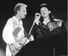 Sting and Bono performing a duet of the Police song, "Invisible Sun" at the Conspiracy of Hope concert on June 15, 1986, at Giants Stadium.