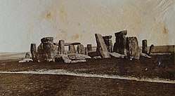 old photograph of stonehenge with toppled stones