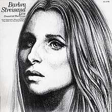 A black and white image of the singer's face appears, with her head positioned towards the left side of the cover.