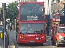 The 626 bus, which is a large red double-decker bus, driving on the road in North Finchley.