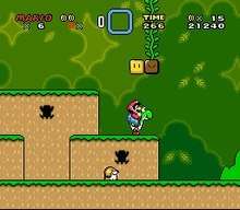 This screenshot shows Mario riding Yoshi during the first level of the game. The scenery shows a jungle environment with floating blocks scattered in the air. The interface displayed around the corners shows the number of lives that the player has, the Dragon Coins collected, the player's stored power-up, the level's remaining time, the player's number of coins, and the total score of the player.