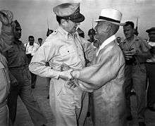 General Douglas MacArthur and Rhee Syngman, Korea's first President, warmly greet one another upon the General's arrival at Kimpo Air Force Base alt text