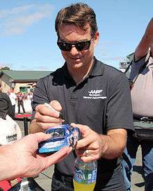 American racing driver Jeff Gordon signing autographs at Sonoma Raceway in 2015
