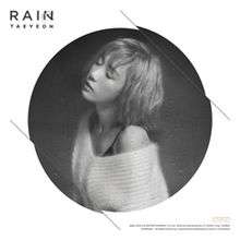 Cover artwork for "Rain", depicting Taeyeon as a short blonde haired woman, shot in black and white
