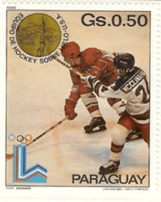 A postage stamp with two ice hockey players on it. One is wearing a red jersey, the other a white one. The stamp also features the word "Paraguay" in the lower right corner.