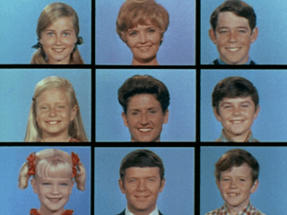 A 3 x 3 grid of squares with face shots of all nine starring characters of the television series: three blond girls in the left three squares, three brown-haired boys in the right three squares, and the middle three squares feature a blond motherly woman, a dark-haired woman, and a brown-haired man; all the faces are on blue backgrounds.