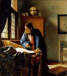 Painting of man with scroll and compass, standing by sunlit window