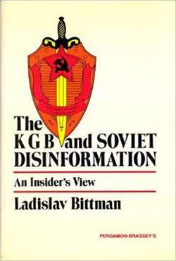 A soviet shield and sword crest occupies the upper left quadrant of the cover. The title is printed in black at the top of the bottom half with the subtitle "An Insider's View" between two thin red lines. The author's name is located under the lower red line. The publisher's name is printed in red in the bottom right corner. The background is a uniform white.