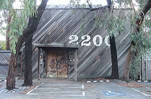 Entrance to the Record Plant studios, surrounded by trees.