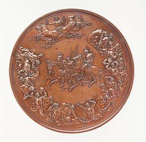 A bronze medal, with allegorical figures surrounding two equestrian figures in the centre