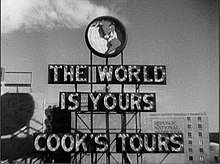 Light up sign that says "The World is Yours" Cook's Tours