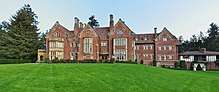Red brick mansion with a sprawling lawn
