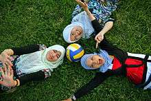 Three Malay Muslim girls wearing tudungs (the Malay language term for an Islamic headscarf).