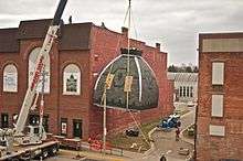 The hoisting of the new cupola on top of the theatre