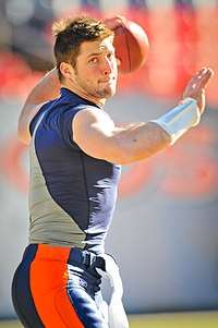 A picture of Tim Tebow throwing a pass.