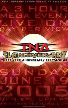 A poster with a gold logo saying "Slammiversary" and a red backdrop