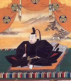 Painting of a mediaeval Asian man seated and dressed in splendour