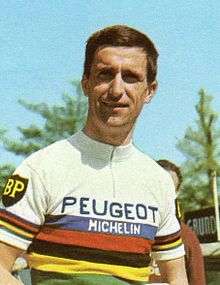 Tom Simpson wearing a white striped jumper, with Peugeot insignia