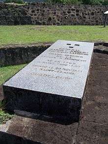 Photo shows a large tombstone with the name Jean Jacques Ambert.