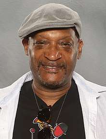Tony Todd, an African-Americal male, is looking directly at the camera wearing a hat.