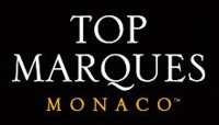 Top Marques Monaco logo, consisting of the event name in all-caps serif font, white text on black, with "Monaco" smaller and in gold
