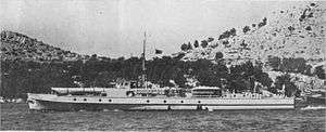 a black and white image of a boat underway