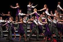 A show choir competing on stage