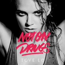 Artwork for "Not on Drugs". Tove Lo is staring at the camera, with her arms up. At the center of the image, the words "Not on Drugs" are written in red letters, while the name of the artist is written below in white letters.