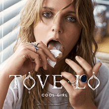 An image of a blonde woman licking a cream-filled baked good; at the lower center, the words "Tove Lo" and "Cool Girl" are printed in white stylized typefaces.