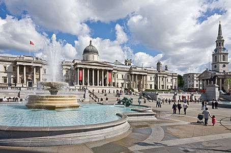 Trafalgar Square, showing a fountain in the foreground and the National Gallery