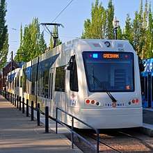 A MAX light rail train parked at the Hatfield Government Center Station in Downtown Hillsboro. The train is a pair of Type 5 LRVs.