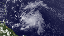 A visible satellite image of a fast-moving and weak tropical storm in the central Atlantic.