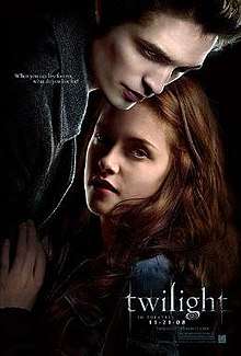 A pale young man fills the top left of the poster, standing over a brown-haired young woman on the right, with the word "twilight" on the lower right.