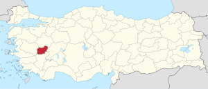 Uşak highlighted in red on a beige political map of Turkeym