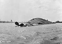 USS Oklahoma overturned, 7 December 1941.