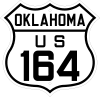 A U.S. route shield in the 1926 style, reading "OKLAHOMA / US / 164".
