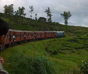 An intercity train, the Udarata Menike, runs through the scenic Sri Lankan hill country