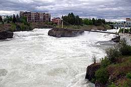The Spokane River rushes passed Canada Island in Riverfront Park