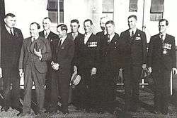 A group of ten men wearing military medals