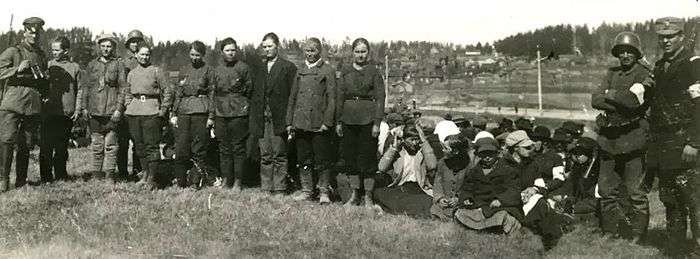 Panoramic photo of captured women and guards