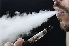 Aerosol (vapor) exhaled by an e-cigarette user.